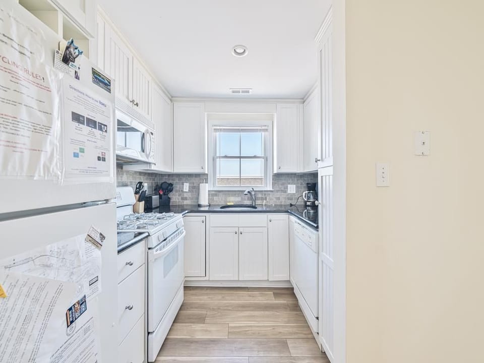 Prepare your favorite meals in this modern kitchen, complete with sleek appliances.