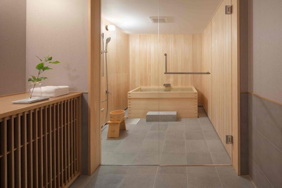 Separate tub and shower, free toiletries, hair dryer, slippers