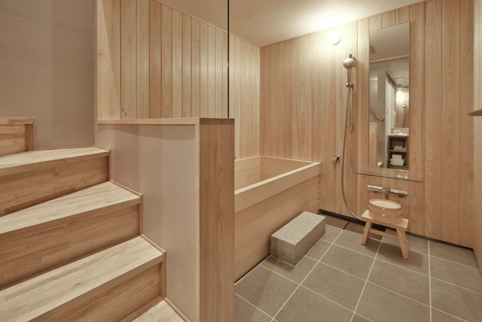 Separate tub and shower, free toiletries, hair dryer, slippers