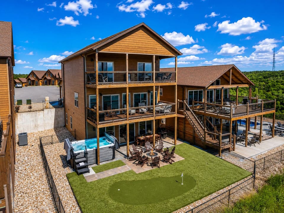 Teh backyard is an oasis of FUN! Private Swim Spa, Firepit, Putting Green- All in a Fenced Area!