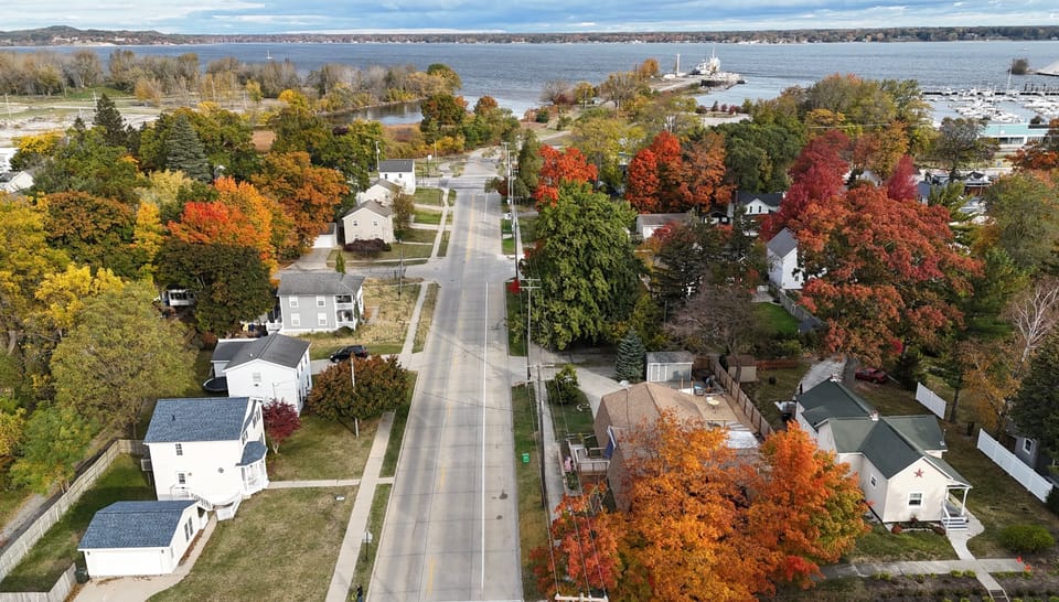 Aerial view of Muskegon Lake. House pictured in lower left corner