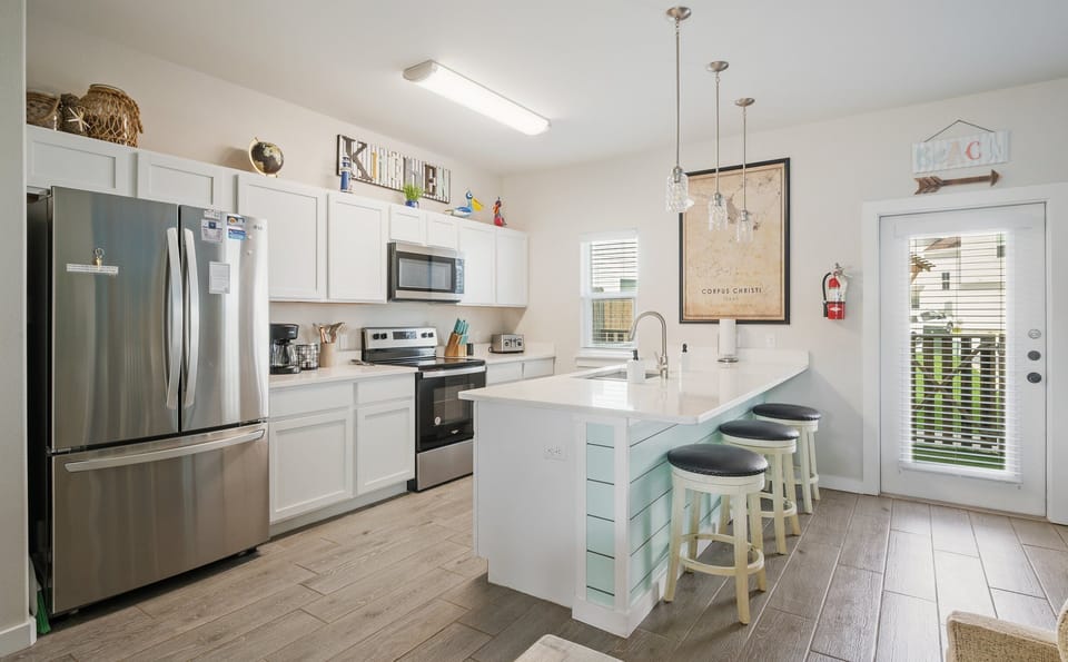 Full kitchen for cooking and entertaining. Access to turfed backyard.