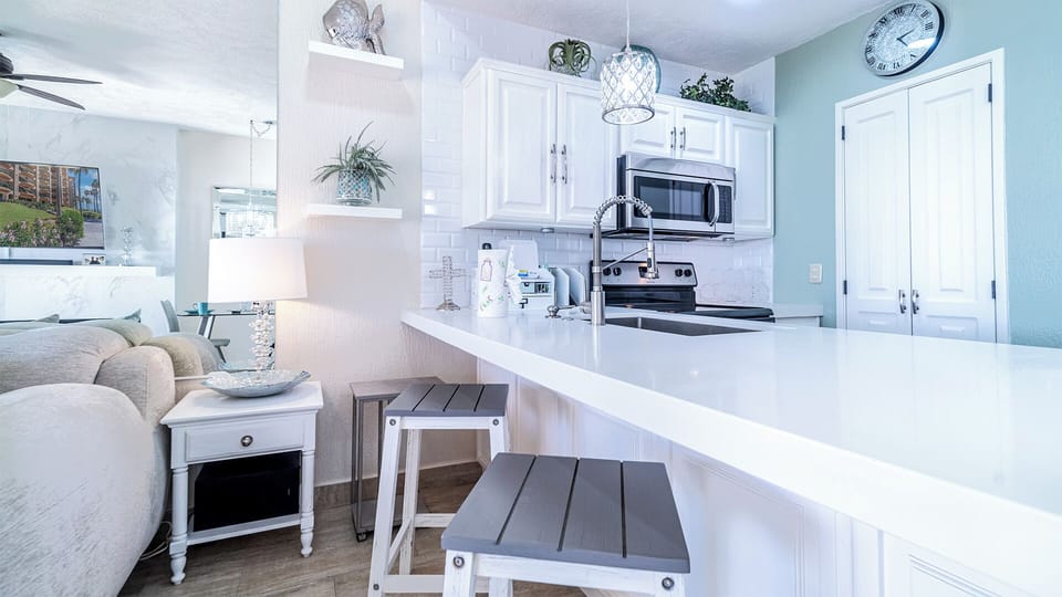 The kitchen counter with additional seating.