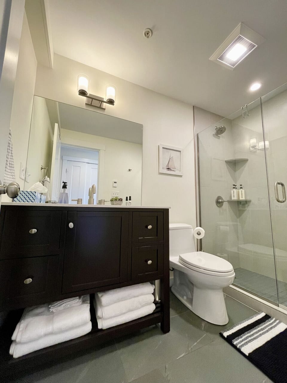 Glass walk in shower, all soaps, towels, and essentials provided.