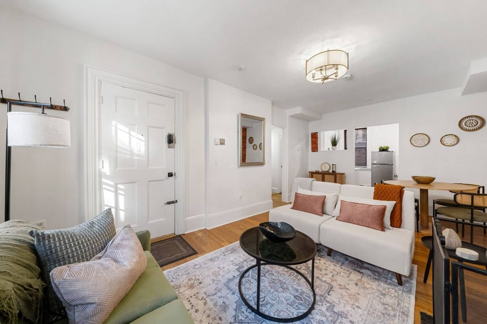 Another view of the living room with plenty of seating for your group, the beige chairs can be folded out to offer 2 more places for guests to sleep!