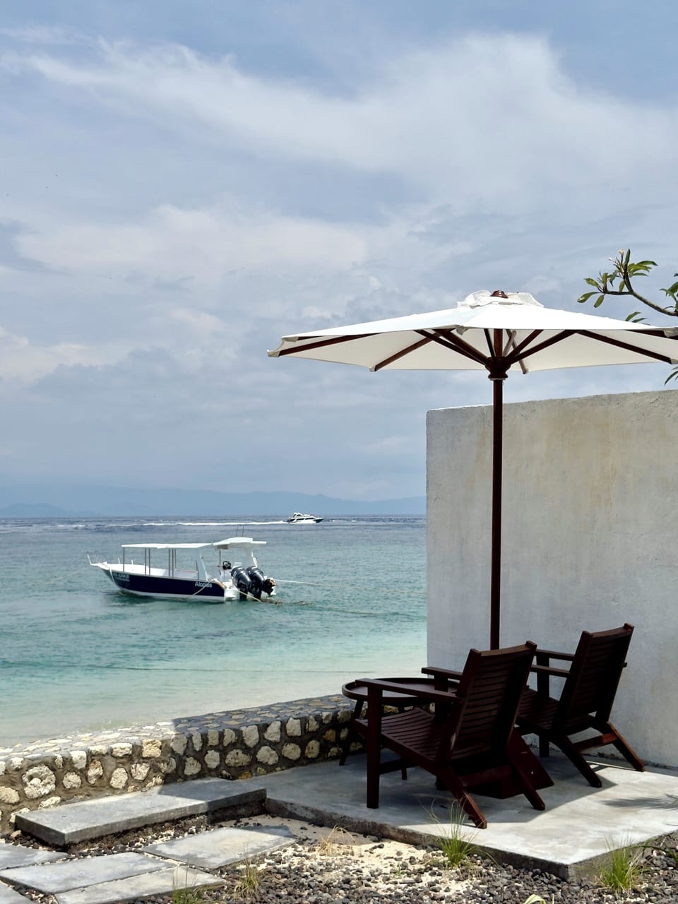 On the beach, white sand, sun loungers, beach umbrellas