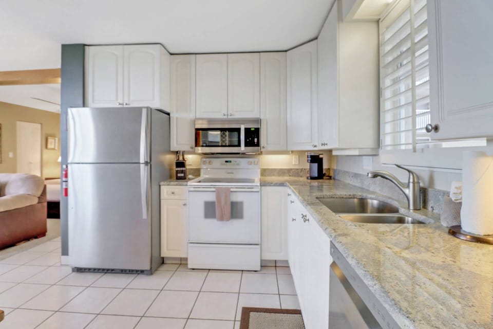 The kitchen is well equipped with full size oven, dishwasher, refrigerator/freezer and microwave.