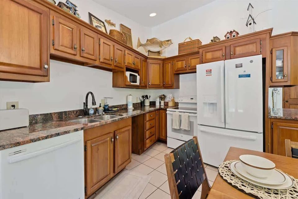 Kitchen: Whip up culinary delights in this charming kitchen with modern appliances and rustic decor!