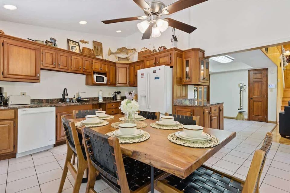 Dining Area: Gather around the elegant table for meals and memories in this updated kitchen!