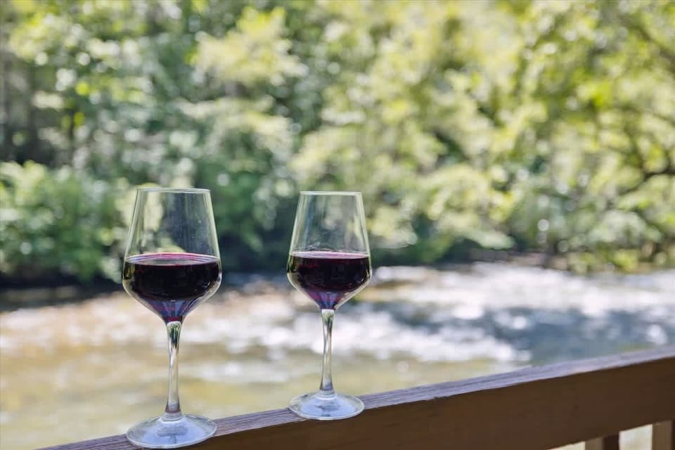 Viewside Retreat: Sip wine by the river and bask in nature's beauty at your tranquil escape!