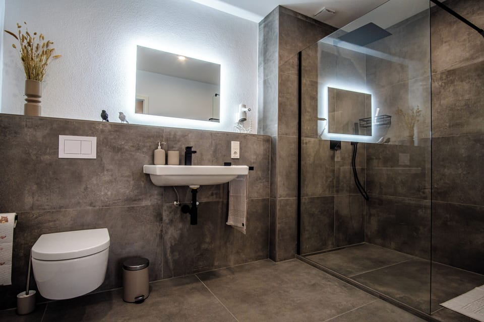 Shower, rainfall showerhead, hair dryer, heated floors