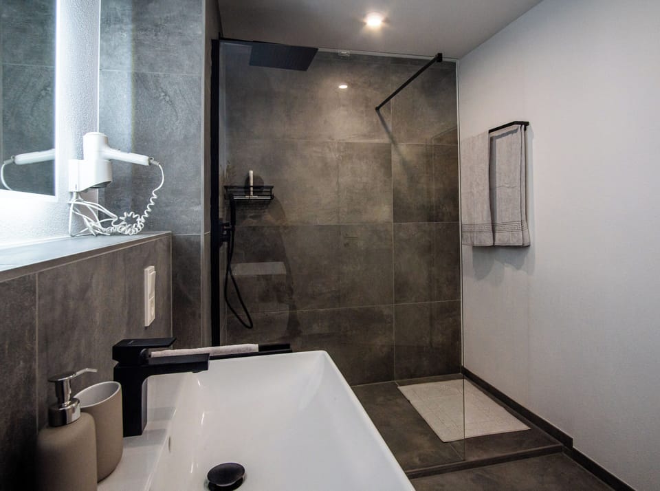 Shower, rainfall showerhead, hair dryer, heated floors