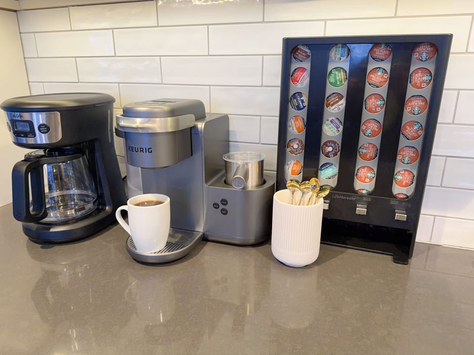 K-Cup machine with milk frother, drip coffee and stovetop espresso maker.