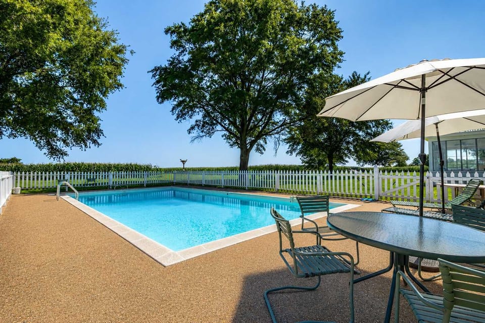 Cool off with a swim, lounge poolside beneath the umbrellas, or spend the afternoon soaking in the peaceful countryside setting. The private pool is a favorite gathering spot after mornings on the water or days exploring the Northern Neck