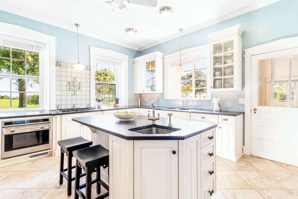 Cooking becomes an experience in this spacious kitchen, featuring top-notch appliances and timeless charm.