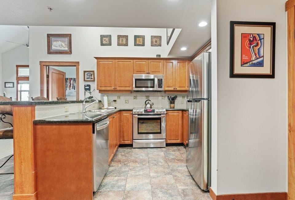 Condo, 2 Bedrooms | Private kitchen | Fridge, oven, dishwasher, coffee/tea maker