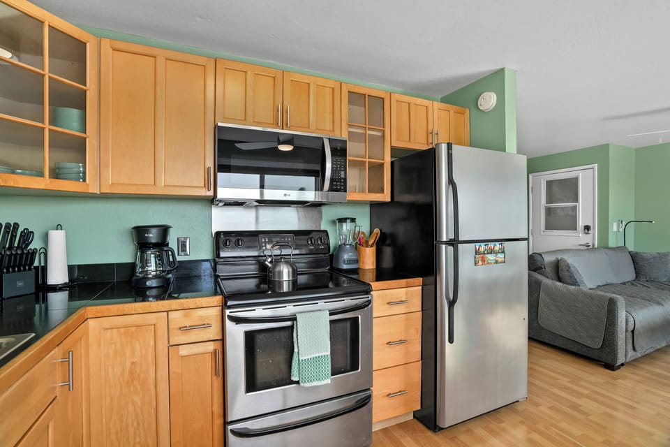 Your fully equipped kitchen features modern stainless appliances, sleek cabinetry, and everything you need to whip up your favorite meals during your stay.