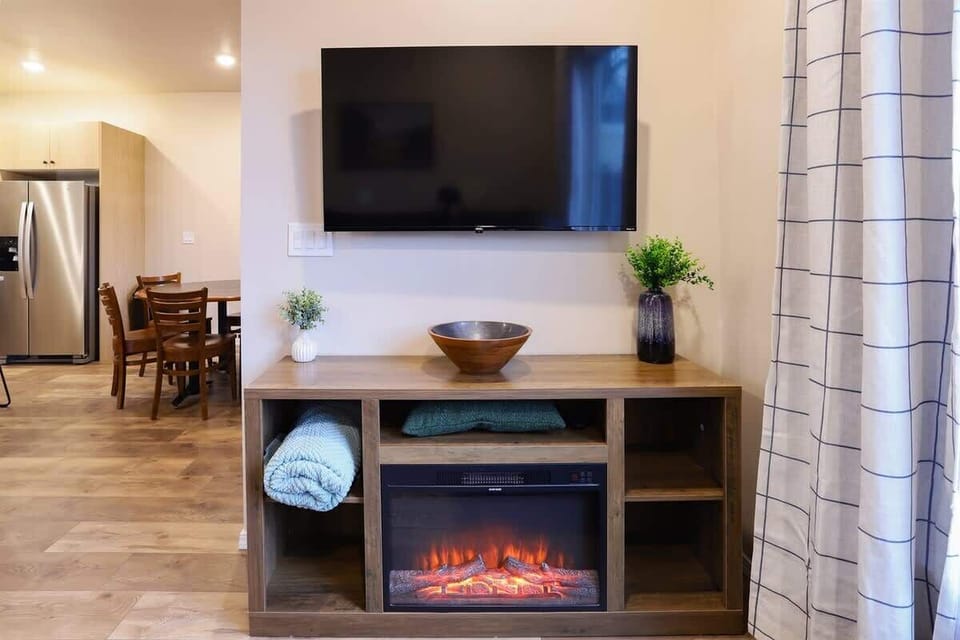 Cozy living room with electric fireplace and space to relax together