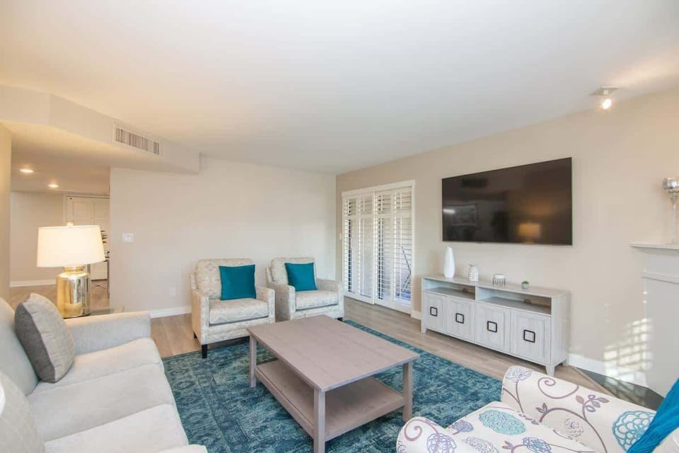 Spacious and stylish living room with plush seating—perfect for relaxing or entertaining.