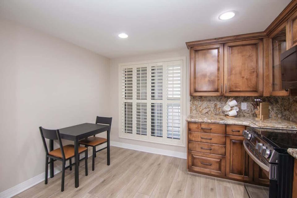 Modern kitchen equipped with top-of-the-line appliances, marble countertops, and all your cooking essentials.