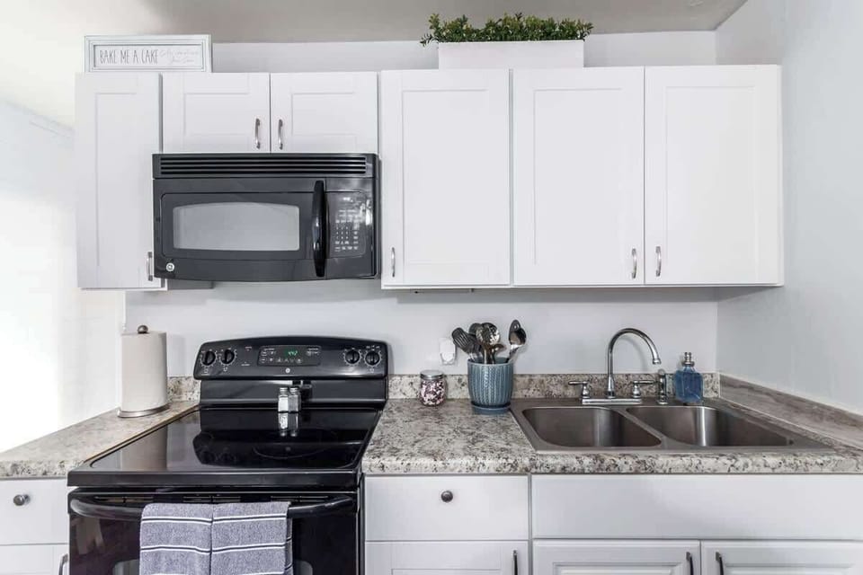 Kitchen has plenty of cabinet space for all your kitchen essentials.
