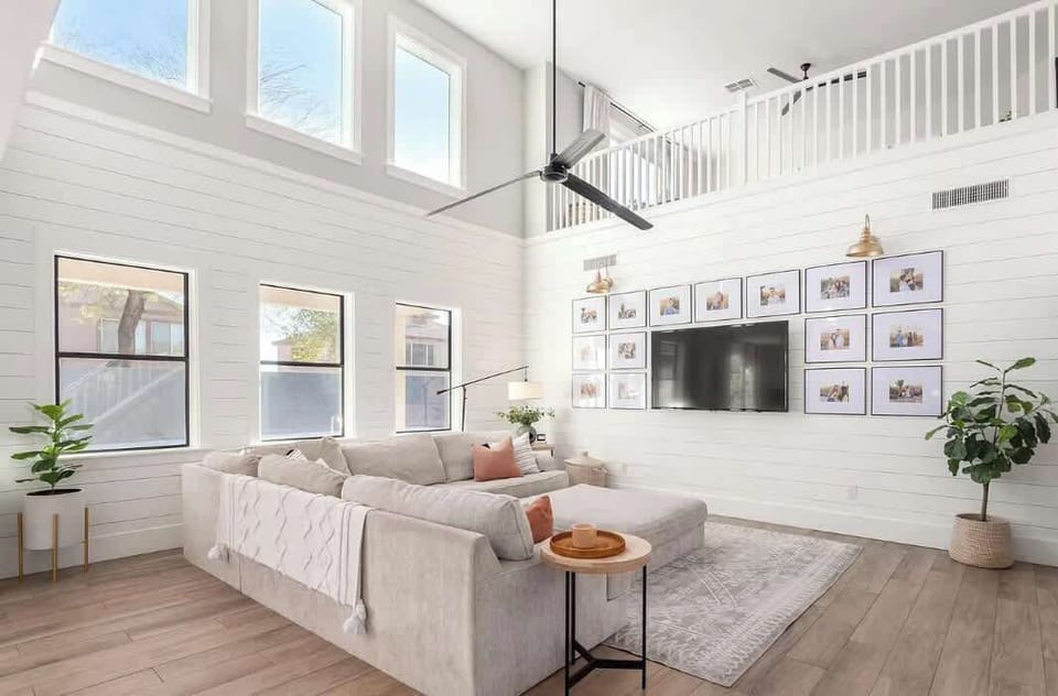 High ceilings, bright colors and style!! This living room will give you a peaceful vibe and comfort during your stay.