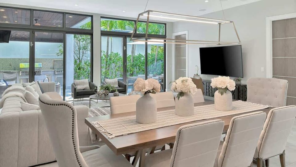 Enjoy meals al fresco at the spacious dining table, ideal for outdoor gatherings and good company.