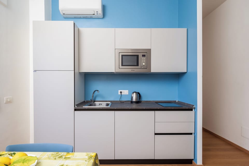 City Apartment, Balcony, City View | Private kitchen | Espresso maker, electric kettle