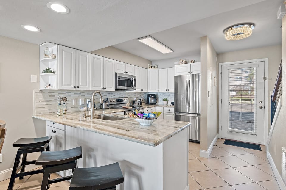Cook delicious meals in the REMODELED and Fully-Stocked Kitchen while overlooking the Gulf of Mexico! 