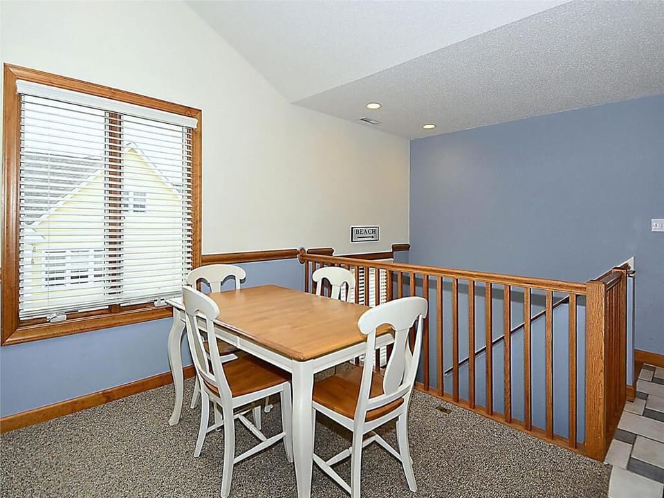 Additional dining nook with cozy seating and plenty of natural light, ideal for morning coffee or casual meals.