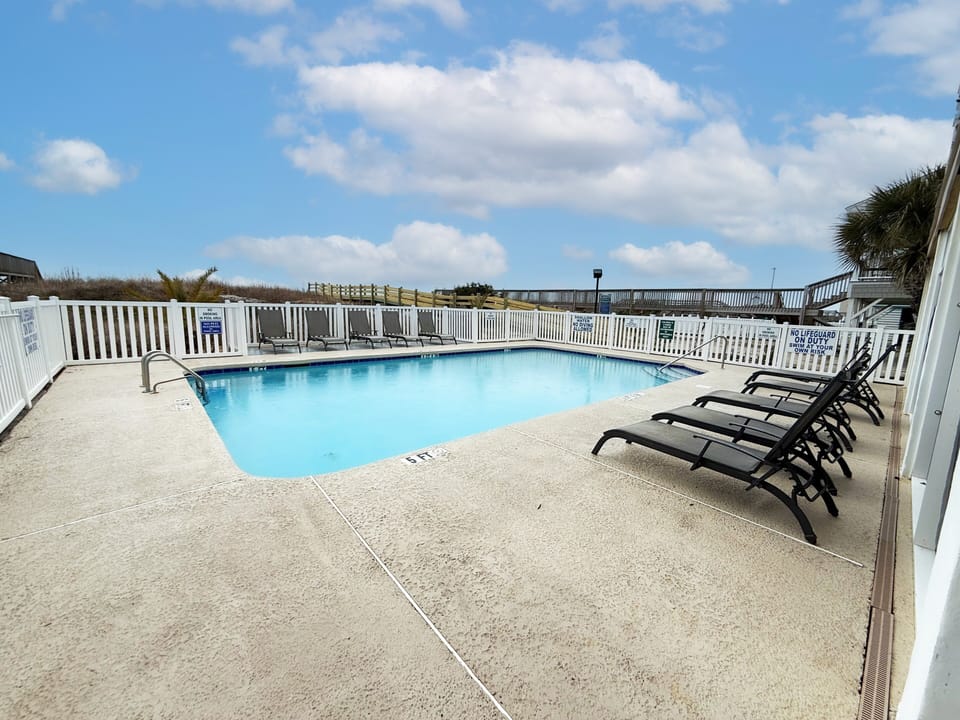 Outdoor Pool - Outdoor pool area available to guests, providing a place to swim or relax when taking a break from the beach.