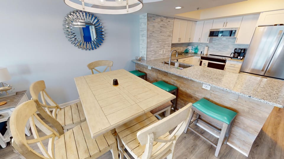 Dining Area - Dining space located beside the kitchen, ideal for meals together or planning the day before heading out to the beach.