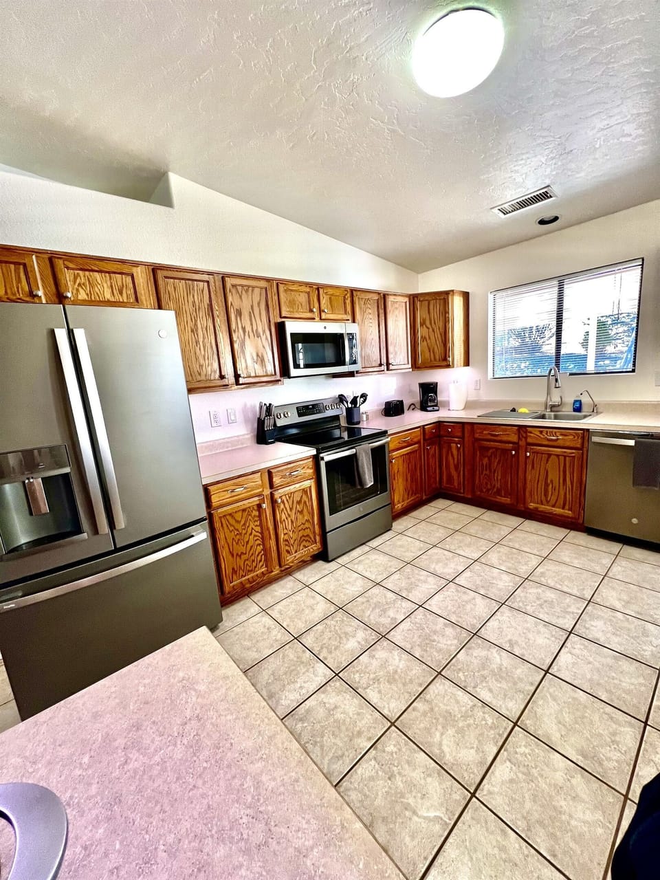 Cooking is a breeze in this fully equipped kitchen, featuring modern appliances and ample counter space.