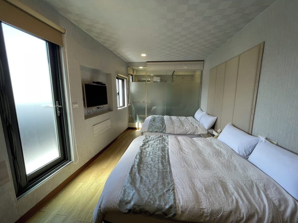 Standard Quadruple Room, City View | Free WiFi, bed sheets