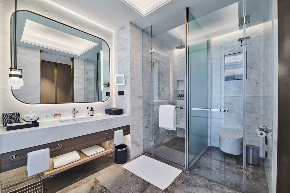 Eco-friendly toiletries, hair dryer, slippers, towels