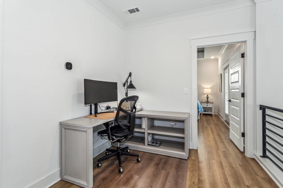 The upper level has a desk and chair for those needing to work while away from home