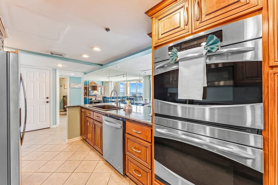 The fully equipped kitchen features granite countertops, stainless-steel appliances, including double ovens, and has everything you need to prepare meals for family & friends.