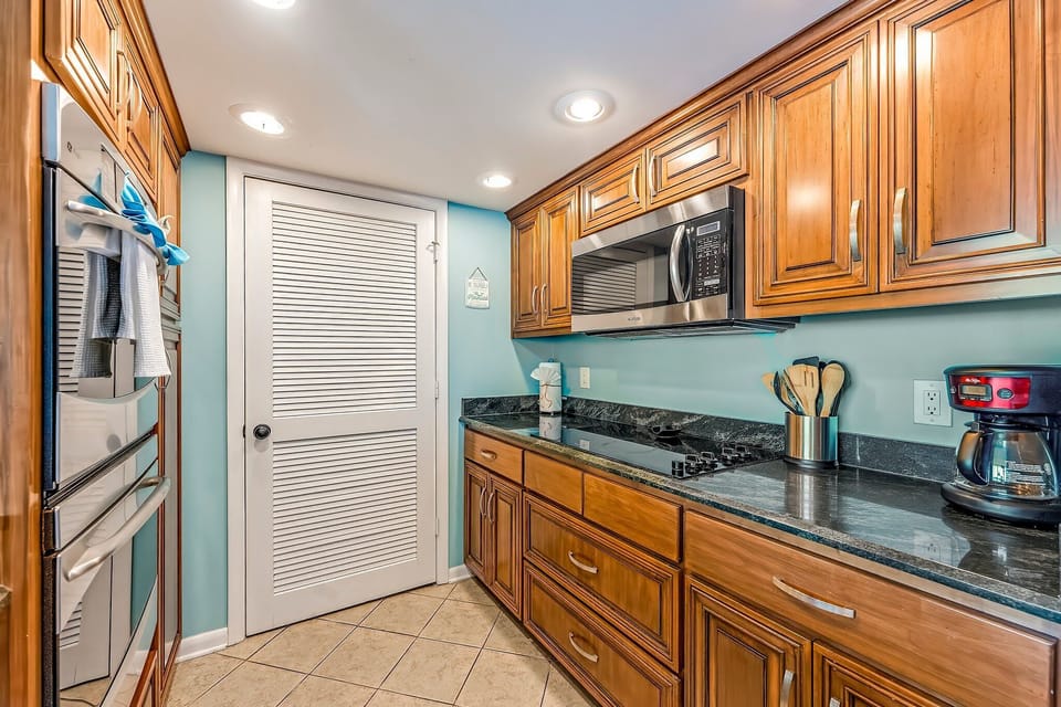 The fully equipped kitchen features granite countertops, stainless-steel appliances, including double ovens, and has everything you need to prepare meals for family & friends.