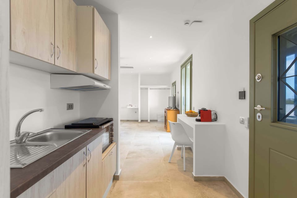 Kitchen Area – Full View with Dining Space
Open and functional layout designed for ease of use and comfort.