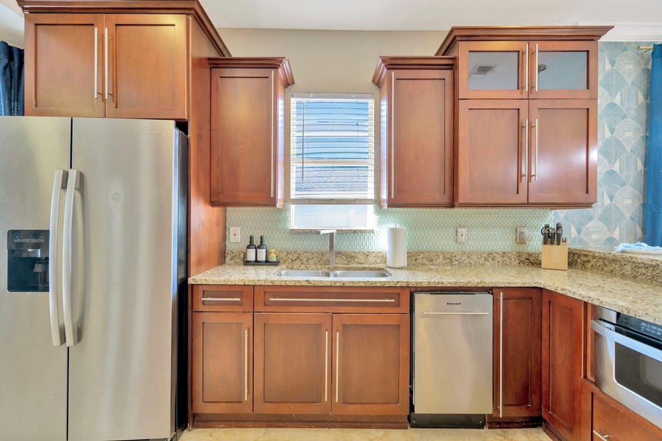 The fully equipped kitchen has its ow window