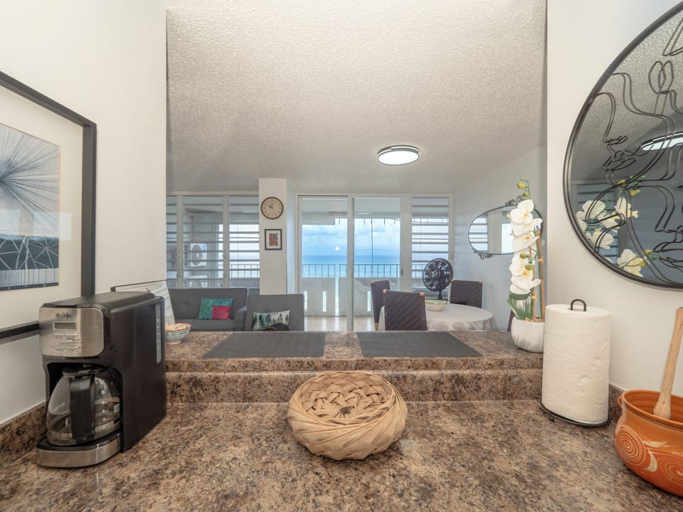 View of living room and dining table from the kitchen
