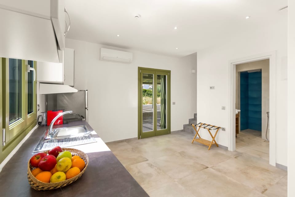 Spacious Kitchen – Fully Equipped for Your Stay
Bright and modern, ideal for meal prep and in-room dining.