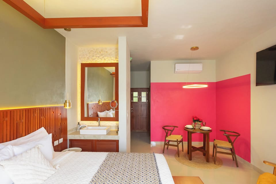 Family Room, Balcony, Courtyard View | In-room safe, laptop workspace, iron/ironing board, free WiFi