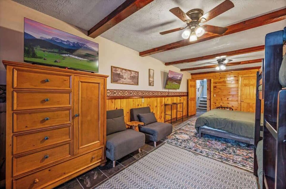 Gray chairs pictured convert into twin beds.