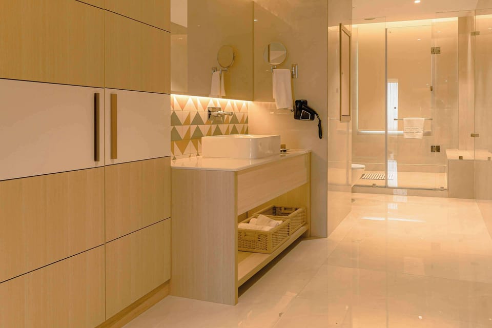 Executive Suite, 1 King Bed, Non Smoking (Separate Living Room) | Bathroom | Shower, free toiletries, hair dryer, slippers
