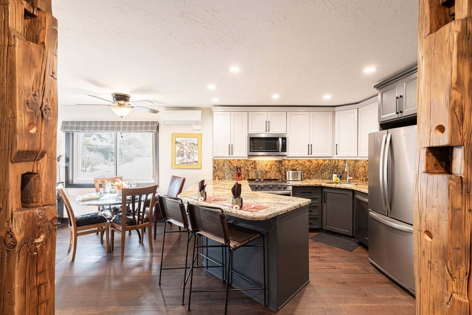 All new kitchen with bar seating and granite counters