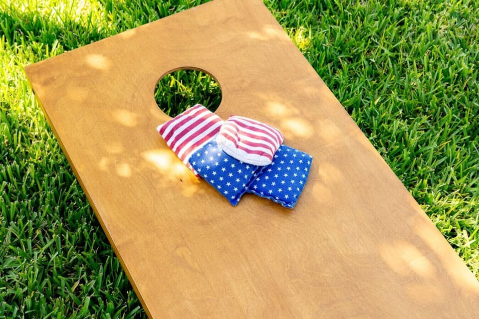 Backyard fun starts here—challenge friends and family to a classic cornhole match on the lawn