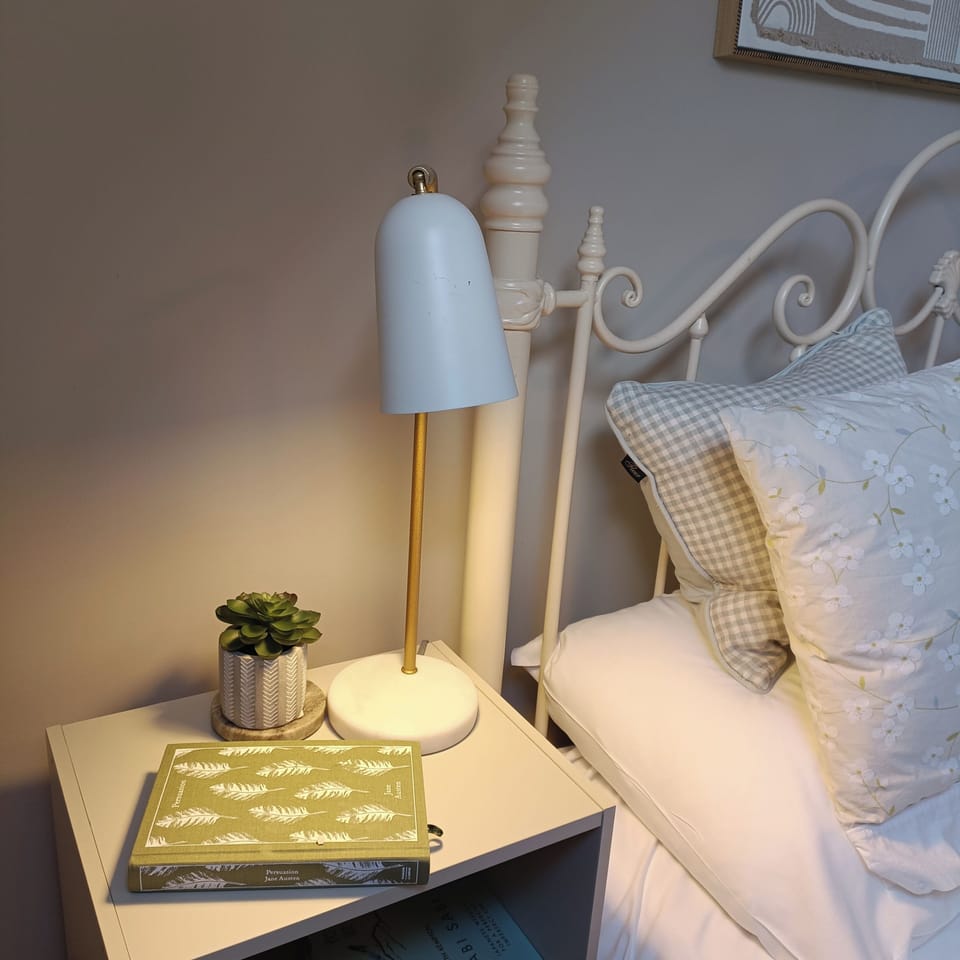 Lovely bedroom with double bed and bedside lockers with lamps. 