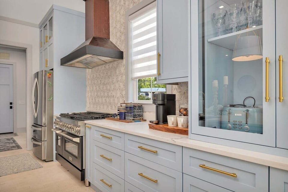 Close-up of kitchen stove and blue cabinetry