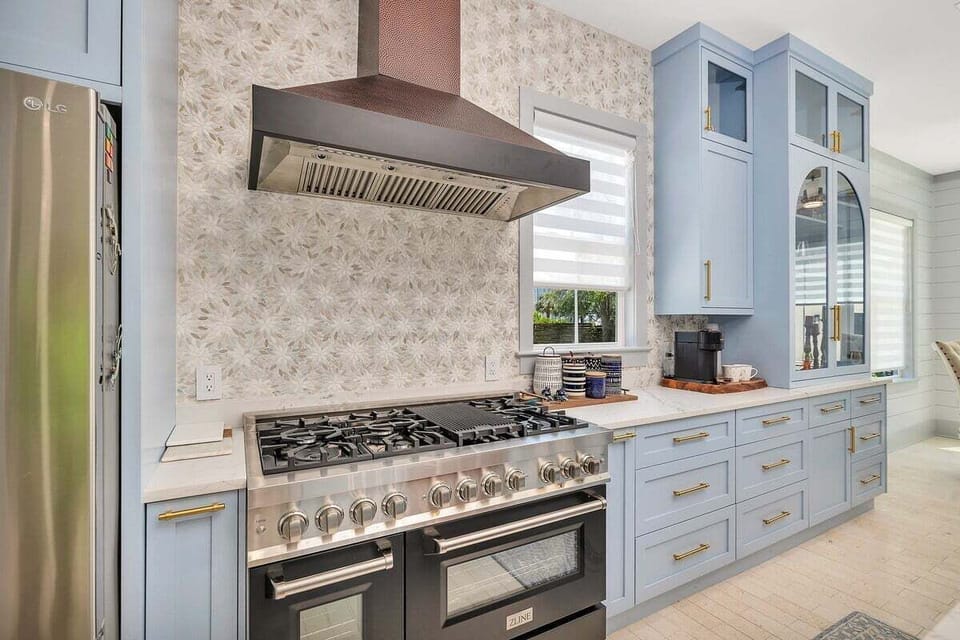 Close-up of kitchen stove and blue cabinetry